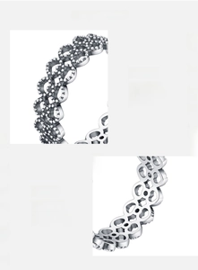 Close-up of S925 sterling silver ring featuring intricate hollow lace patterns and polished finish