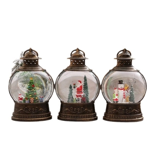 Set of 3 vintage bronze Christmas snow globe lanterns with Santa and snowman scenes
