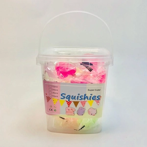 Close-up of children's glowing squishy toys in a clear plastic bucket with handle