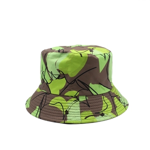 Wide brim fisherman bucket hat featuring abstract geometric camo print in green and yellow
