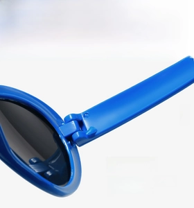 Macro detail of blue sunglasses showing the sturdy hinge for smooth and durable opening