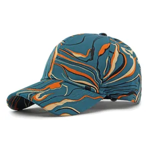 Classic baseball cap with abstract marble print in blue, orange, and beige on white background
