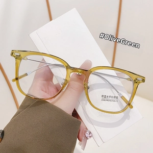 Olive green anti-blue light glasses with metal temples and UV400 protection detail