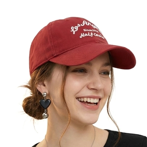 Retro red cotton baseball cap with Los Angeles white letter embroidery on a model