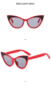 Front and side views of red cat-eye kids sunglasses with gray lenses and black glitter