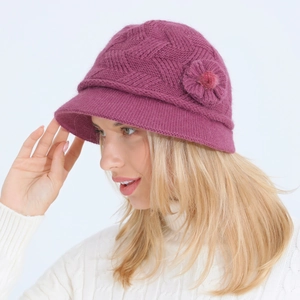 Detailed macro of a purple knitted bucket hat with a 3D flower decoration for women