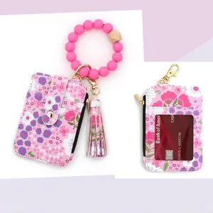 Pink floral card wallet with silicone beaded bracelet and tassel charms, size specifications