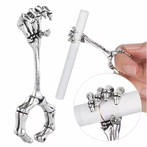 Close-up of skeleton hand cigarette holder ring with vintage silver finish metal details