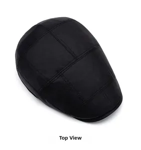 Top view detail of black newsboy cap with textured lattice pattern and premium stitching