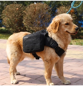 Tactical black dog backpack harness with side storage pockets on a Golden Retriever