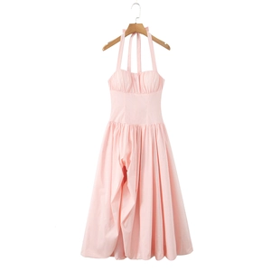 Detailed view of pink halter neck dress featuring pleated bodice and backless design