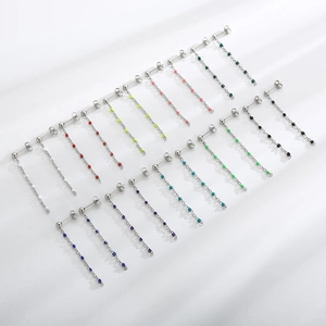 Macro shot of colorful resin long tassel earrings displayed in multiple vibrant shades