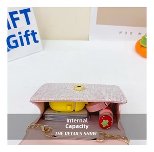 Internal capacity of pink tweed pearl bag showing space for earphones and lipstick