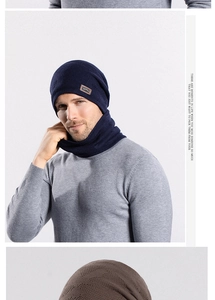 Detail of winter knitted beanie and neck warmer set with warm fleece lining and logo patch