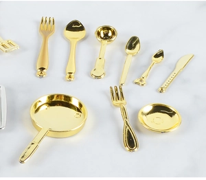 Detailed top view of 10-piece miniature golden metal dollhouse kitchenware set