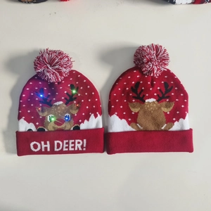Detail of LED Christmas knit beanie featuring red reindeer pattern and OH DEER text