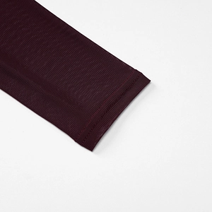 Detail of burgundy long sleeve cuff featuring mesh texture and neat double-needle stitching