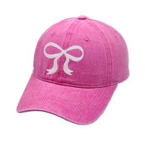 Pink washed cotton baseball cap with white bow embroidery and adjustable strap