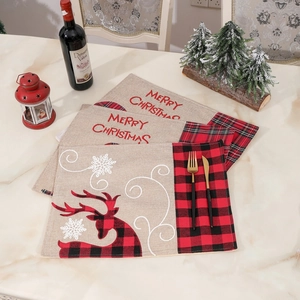 Christmas burlap placemats with Santa reindeer motif and red black checkered border