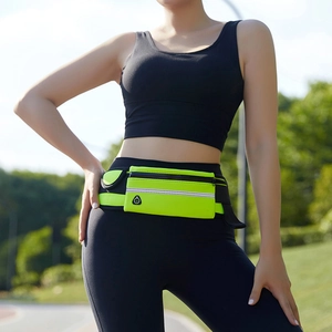 Outdoor runner wearing neon green running belt with reflective strip and earphone hole