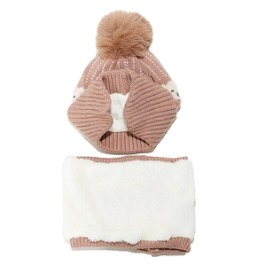 Close-up of kids winter knit hat and scarf set with soft plush lining and pom-pom