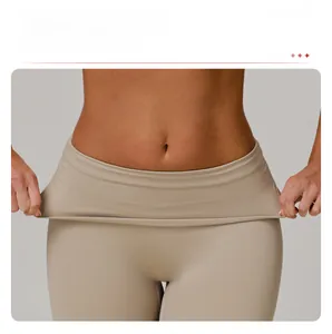 Detail shot of the fold-over waistband on high-waist yoga pants showing elastic texture