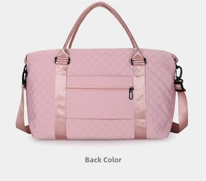 Pink quilted travel bag back view showing the trolley sleeve and zip pocket detail