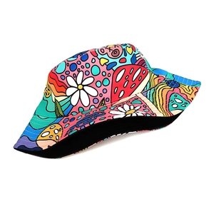 Detail view of colorful mushroom and daisy pop art print on twill cotton bucket hat