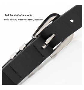 Detail of solid silver alloy buckle and black leather texture on a Y2K style belt