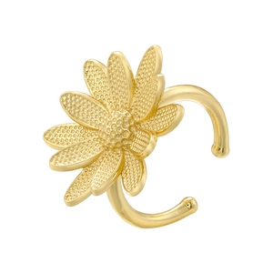 Macro shot of gold sunflower ear cuff detailing metallic textures on white background