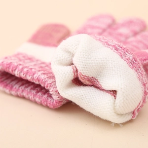 Close-up of kids warm knit gloves with thick fleece lining and pink gradient pattern