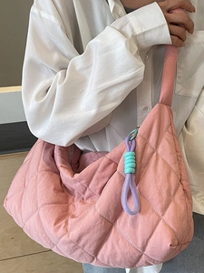Pink quilted large capacity tote bag with decorative knot charm for casual summer style