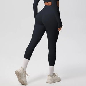 Close-up of high-waisted black yoga pants with push-up effect and matte texture