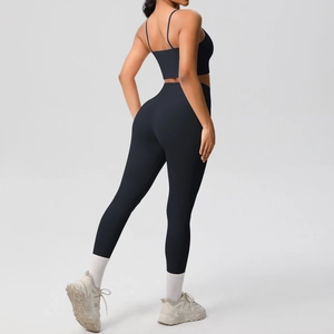 Detail view showing the back cut and fit of black high-waist yoga set with thin straps