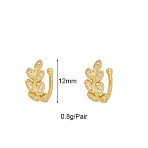 Detailed view of 12mm golden leaf ear cuffs with sparkling cubic zirconia on white background