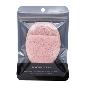 Pink heart-shaped face sponge with porous texture in professional retail packaging