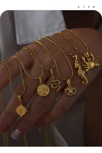 Close-up of gold plated snake chains with various geometric animal pendants for women