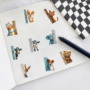 Vibrant cartoon animal stickers on a notebook featuring pandas, bears and lions
