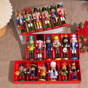 Stack of glittery wooden nutcracker soldier sets featuring kings and musicians