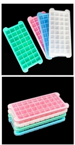 Multi-colored 24 and 36 grid ice cube trays with lids stacked on black background