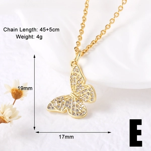 Macro view of a gold-plated butterfly pendant necklace with precise dimensions 19mm x 17mm