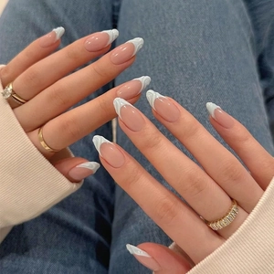 Almond shaped French press-on nails with white 3D ripple marble design on nude base