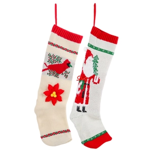 Knitted Christmas stockings with cardinal and Santa patterns on a clean white background