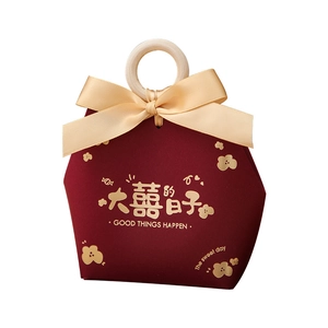 Red Chinese wedding candy box with champagne ribbon bow and round wooden handle