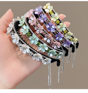 Detail of five hair combs featuring colorful acrylic flowers and sparkling tassel crystals