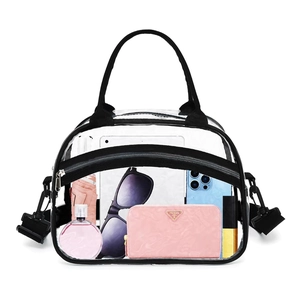 Detailed view of clear PVC toiletry bag with black trim showing spacious interior storage