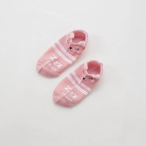 Detail of pink cotton baby socks featuring cute cartoon animal face and soft embroidery
