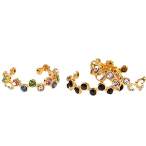 Golden snake-shaped ear cuffs with colorful rhinestones in a minimalist chic style