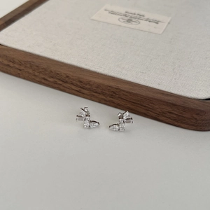Close-up of S925 sterling silver butterfly earrings with sparkling cubic zirconia stones