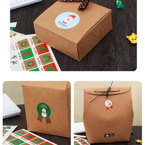 Christmas gift sealing stickers on kraft bags and boxes over a dark wooden desk